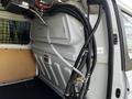 2016 Ford Transit Connect interior showing storage compartments and wiring systems along the side wall