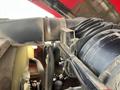 A close-up view of the engine components of a 2014 Toro Groundmaster 5910 showcasing hoses and air intake parts