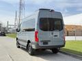 2019 Mercedes-Benz Sprinter van in gray with a high roof and large rear windows parked on a paved surface