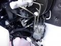 Close-up view of the engine bay of a 2016 Mercedes-Benz Sprinter showing various components including the brake master cylinder and hydraulic lines