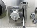 A silver control valve with labeled positions for open and closed, featuring a circular handle and a metallic finish