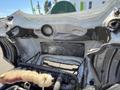 The image shows the engine compartment of a 2022 Freightliner Cascadia with exposed components including hoses and fluid reservoirs