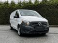 A 2023 Mercedes-Benz Metris van with a white exterior and black front grille parked on a gravel surface