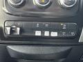 Control panel of a 2016 RAM 2500 featuring buttons for driving lights work lamp ton haul rear off and auxiliary functions