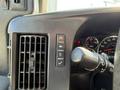 Interior dashboard controls of a 2017 Chevrolet Express including air conditioning buttons and gear shift indicator
