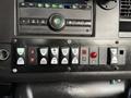 Dashboard controls of a 2019 Chevrolet Express featuring buttons for lights and ventilation