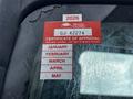 A red and white vehicle inspection sticker with the words "CERTIFICATE OF APPROVAL" and months listed from January to May is affixed to the windshield of a 2014 Hino 195