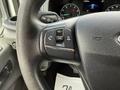 Steering wheel controls of a 2022 Ford Transit including volume and function buttons