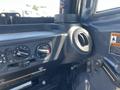 Interior dashboard area of a 2014 Kubota X1100C featuring control knobs and a dashboard vent