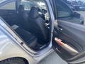 A 2017 Acura TLX showcasing the interior with black leather seats and a view of the front dashboard and steering wheel