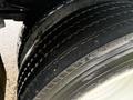 Close-up of the tires on a 2019 Freightliner M2 showing the tread pattern and details of the rubber surface