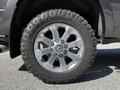 A close-up view of a silver alloy wheel on a 2022 RAM 3500 equipped with a Goodyear tire featuring an aggressive tread pattern