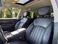 Interior view of a 2017 Infiniti QX50 showing black leather seats and a centrally located console with controls