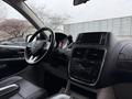 Interior view of a 2017 Dodge Grand Caravan featuring a steering wheel dashboard and infotainment system