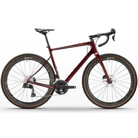 A maroon 2026 Boardman ADV 9.6 Carbon Gravel Adventure Road Bike featuring sleek lines gravel tires and a modern design with drop handlebars and disc brakes