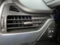 Close-up view of the dashboard vents and controls in a 2016 Chevrolet Tahoe with a sleek design and black trim