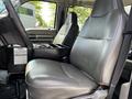 Interior view of a 2009 Ford F-550 showing a driver's seat and a center console with storage and controls