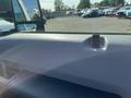 A close-up view of the dashboard of a 2015 Ford F-450 SD showing the textured surface and a small latch or clip on the dashboard