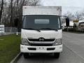 A white 2013 Hino 195 box truck with a front view showcasing its large windshield headlights and side mirrors