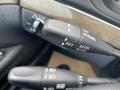 A close-up of the cruise control stalk from a 2007 Mercedes-Benz E-Class showing controls for set accel and decel