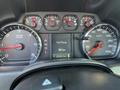 Close-up view of the dashboard of a 2018 GMC Sierra 1500 featuring gauges for RPM speed odometer and fuel range display