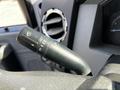 Close-up of a black multi-function control stalk from a 2016 Ford F-550 used for operating wipers and turn signals