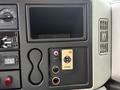 Dashboard controls of a 2014 International TerraStar displaying various gauges switches and a blank display area