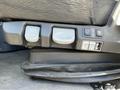The control panel of a 2022 Freightliner Cascadia featuring buttons for seat adjustments and various functions