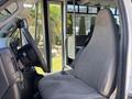 2020 Chevrolet Express interior showing the driver's seat and dashboard with steering wheel and gear lever