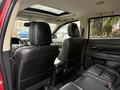 Interior view of a 2016 Mitsubishi Outlander showing black leather seats and a panoramic sunroof