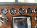 Dashboard of a 2009 Peterbilt Highway featuring multiple gauges including speedometer oil temperature and manifold pressure display