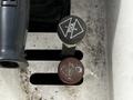 A close-up of two control knobs labeled Tool 1 and Tool 2 in a metallic panel of a 2012 Freightliner M2 106