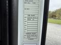 A 2012 Volvo VNL truck door panel featuring labels for cab paint and chassis paint colors with specifications and part numbers displayed