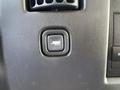 Close-up of a control button in a 2009 Chevrolet Express with a trailer icon indicating towing functionality