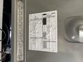 A 2017 Chevrolet Express with a paper diagram showing electrical specifications and fuse box layout attached to the interior panel