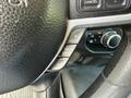 Close-up of the steering wheel of a 2020 Ram 2500 showing gear limit controls and buttons for adjusting settings