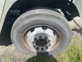 A close-up view of the wheel and tire of a 2007 Morgan Olson Workhorse W42 featuring a steel rim and a thick rubber tire with visible tread patterns