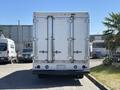 Rear view of a 2019 Freightliner MT45 with a white cargo box and double rear doors