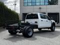 2024 Ford F-550 in white color with a flatbed design visible showcasing wheels and chassis with a sturdy framework and rear-facing lights