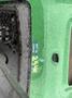 A green John Deere 2653B Precision machine displaying a label indicating the next oil change at 2540