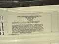2011 International 7500 vehicle noise emission control information label with details about regulations for noise emission and associated compliance