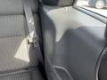 Interior view of the back seat of a 2005 Chrysler PT Cruiser showing a seatbelt and textured fabric on the seat