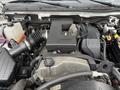 The image shows the engine compartment of a 2012 GMC Canyon with various components including the air intake and engine cover