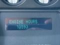 Display screen of a 2011 Ford F-550 showing engine hours read 13393