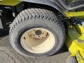 Close-up of a tire mounted on a yellow Kubota F3990 with visible tread pattern and wheel rim