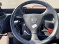 Top view of the steering wheel and controls of a 2018 Kubota RTV-X 1100 C with a labeled control lever and a red push-button