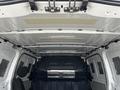 Interior view of a 2018 Mercedes-Benz Metris cargo van showing the ceiling and front seats with a simple and functional design