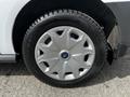 A silver wheel with a five-spoke design mounted on a tire of a 2016 Ford Transit Connect