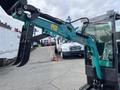 A 2024 AGT Industrial Green QH13R Mini Excavator with a claw attachment on the arm designed for digging and gripping materials
