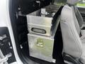 A custom aluminum storage box installed in the rear seat area of a 2017 Ford F-150